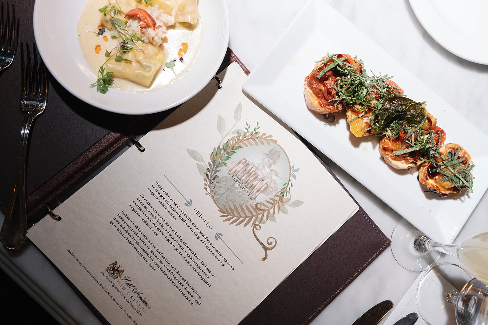 Gourmet Creole pasta and appetizers from Criollo Restaurant at Hotel Monteleone, New Orleans.