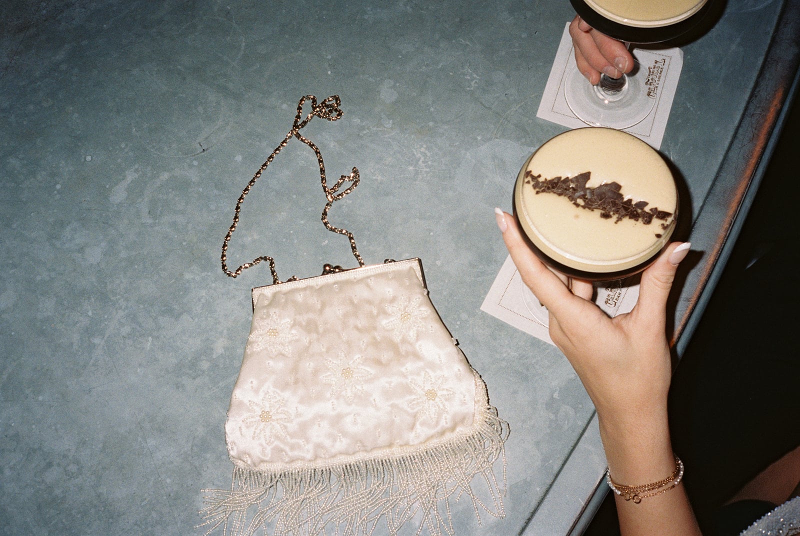 Elegant evening with espresso martinis and a vintage clutch at The Roosevelt New Orleans.