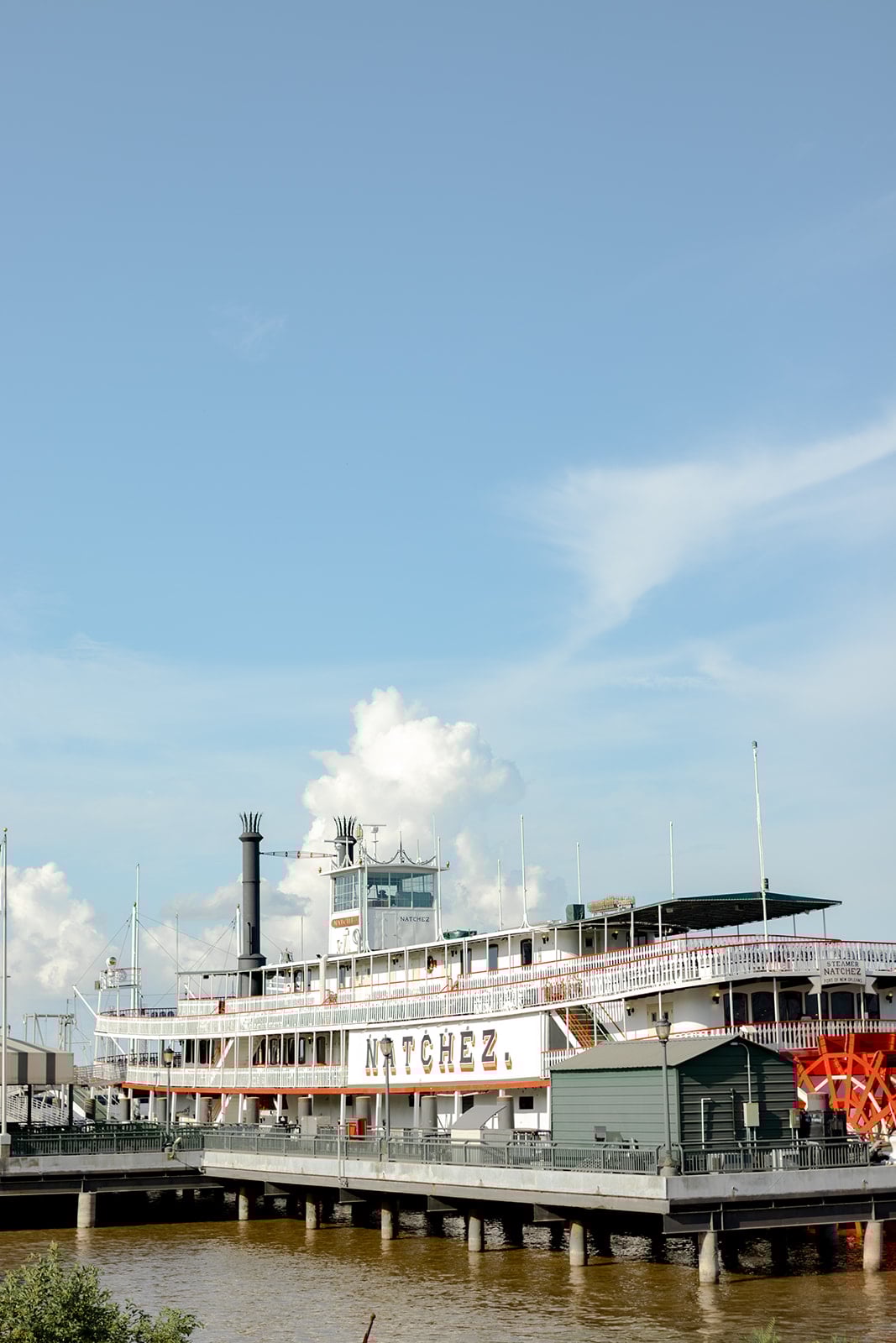 Historic Steamboat Natchez paddlewheeler docked on the Mississippi River in New Orleans.