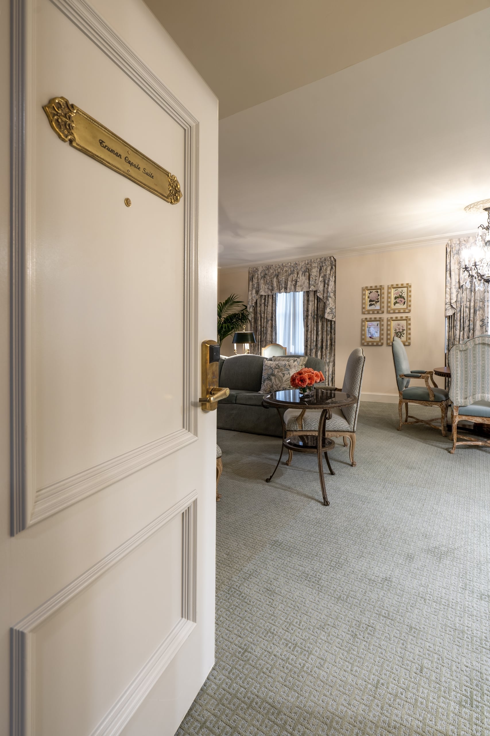 Truman Capote Suite, New Orleans, featuring an elegant living area with classic decor.