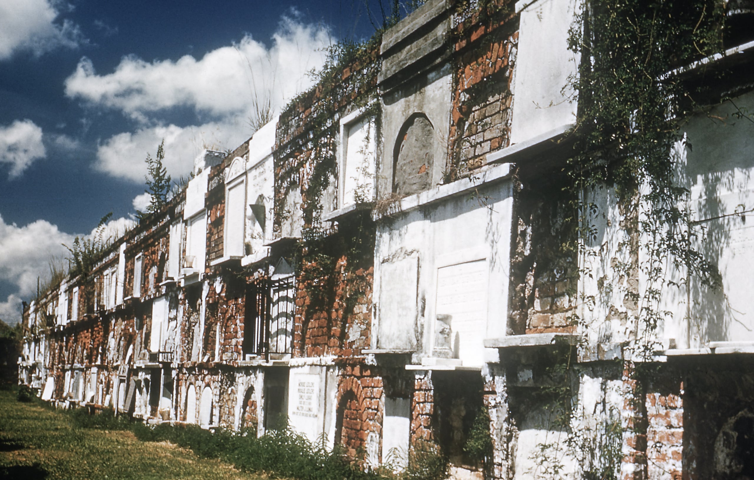 Wall vaults of marble, brick and cement in St. Louis Cemetery No. 1, New Orleans, Louisiana, USA. Vaults in New Orleans are often above ground because of the high water table. Photo taken in 1953.