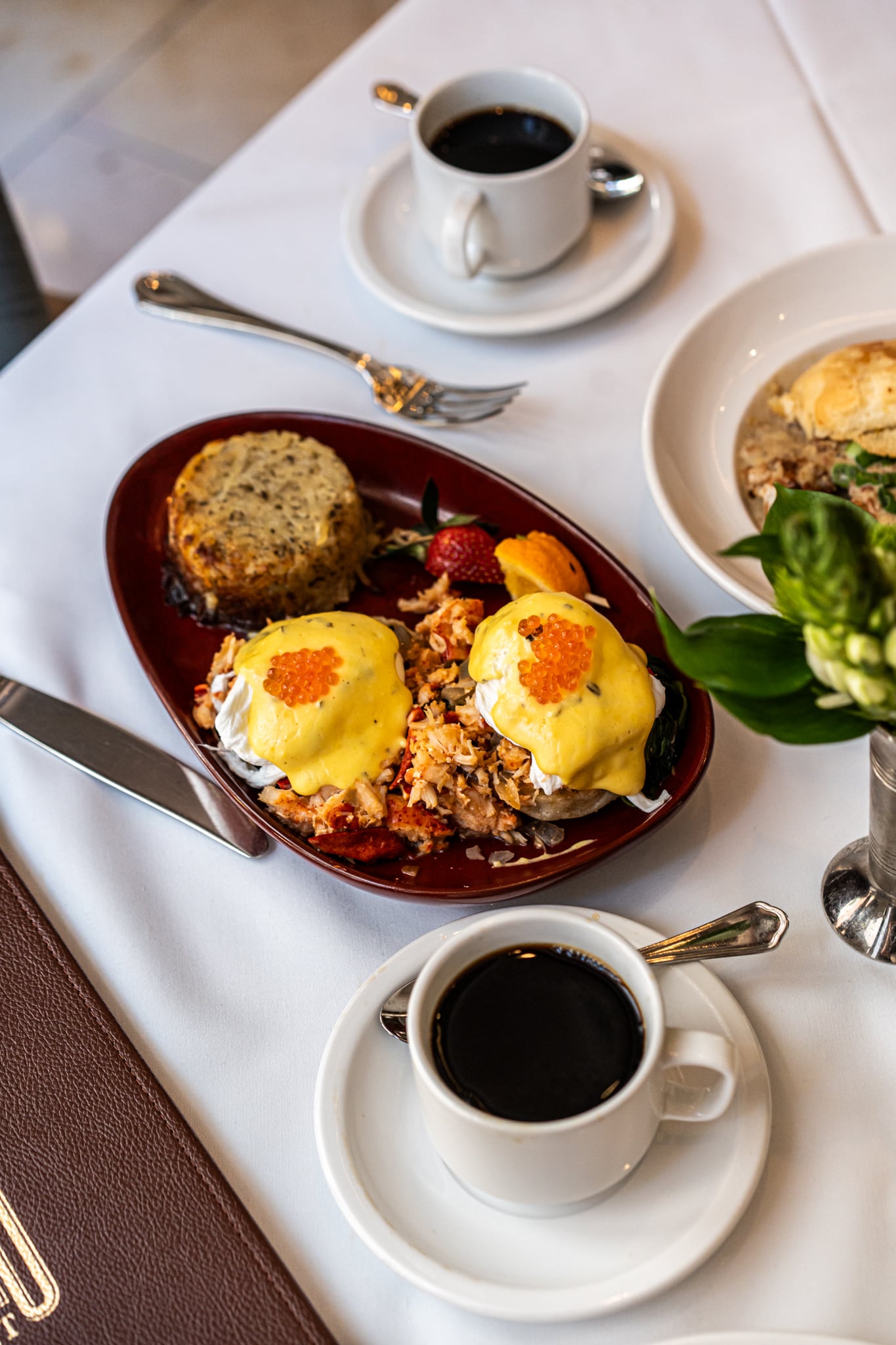 Eggs Benedict and Coffee on table